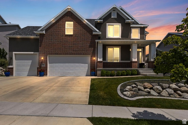 776 W Horizon Dr, Lehi, UT 84043 - traditional-style house featuring a porch, brick siding, driveway, a yard, and a garage