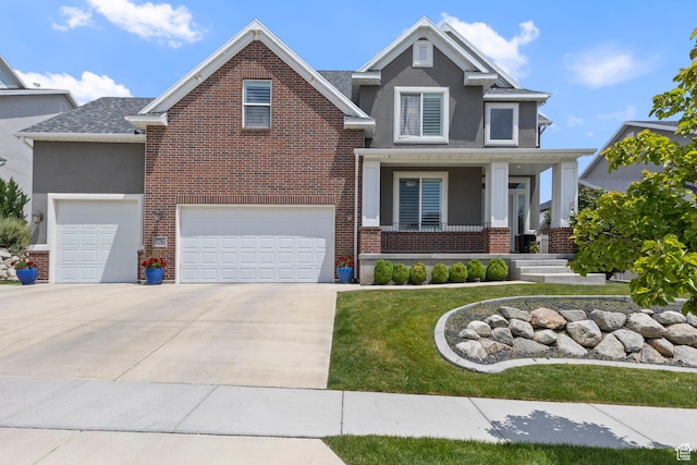 776 W Horizon Dr, Lehi, UT 84043 - traditional home featuring stucco siding, covered porch, driveway, brick siding, and a front yard