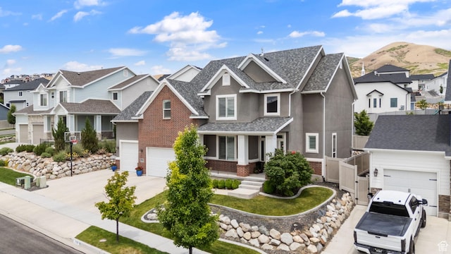 776 W Horizon Dr, Lehi, UT 84043 - craftsman-style house featuring a residential view, driveway, stucco siding, brick siding, and roof with shingles