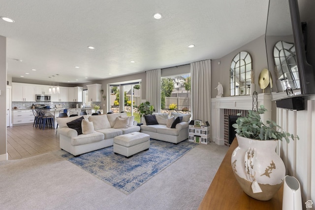 776 W Horizon Dr, Lehi, UT 84043 - living room with carpet floors, recessed lighting, a brick fireplace, and a textured ceiling