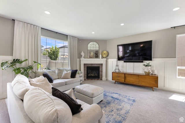 776 W Horizon Dr, Lehi, UT 84043 - living room with a wainscoted wall, recessed lighting, a decorative wall, carpet, and a brick fireplace