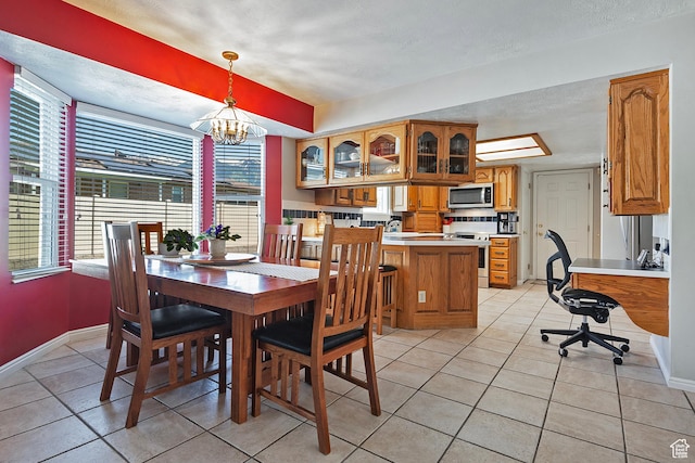9039 S 1660 E, Sandy, UT 84093 - dining room featuring light tile patterned flooring, baseboards, a chandelier, and a textured ceiling