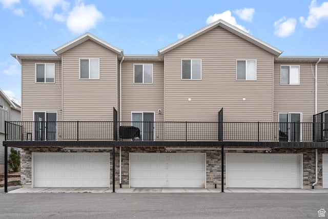 177 E 610 S, Santaquin, UT 84655 - rear view of property with a garage and stone siding