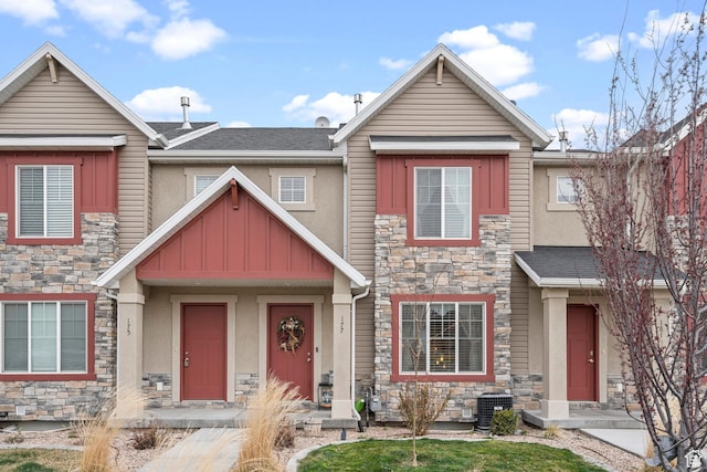 177 E 610 S, Santaquin, UT 84655 - view of property featuring stone siding, stucco siding, central AC, and roof with shingles