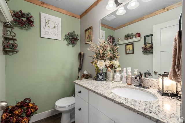 177 E 610 S, Santaquin, UT 84655 - half bath featuring toilet, vanity, ornamental molding, baseboards, and wood finished floors