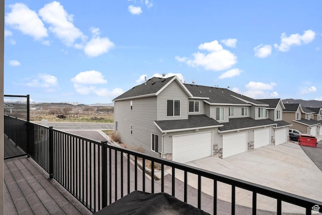 177 E 610 S, Santaquin, UT 84655 - wooden deck with driveway, a residential view, an attached garage, and a mountain view
