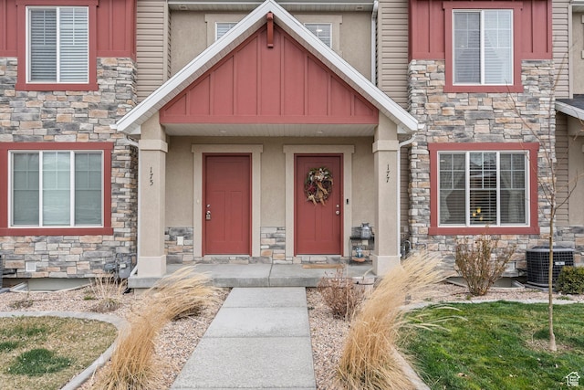 177 E 610 S, Santaquin, UT 84655 - doorway to property with stone siding, board and batten siding, central air condition unit, and stucco siding