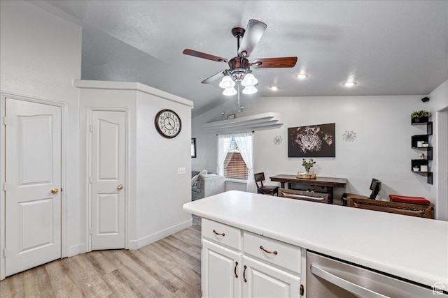 2811 E Paradise Way, St George, UT 84790 - kitchen with stainless steel dishwasher, light wood-type flooring, ceiling fan, vaulted ceiling, and white cabinets