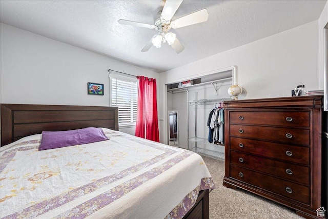 2811 E Paradise Way, St George, UT 84790 - bedroom with light colored carpet, a closet, a ceiling fan, and a textured ceiling