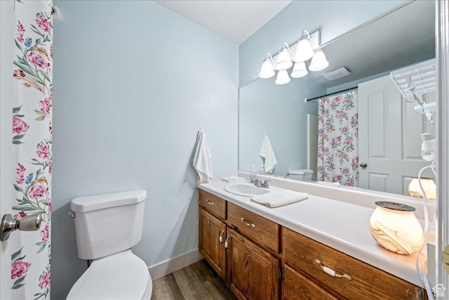 2811 E Paradise Way, St George, UT 84790 - full bath with toilet, wood finished floors, vanity, baseboards, and curtained shower