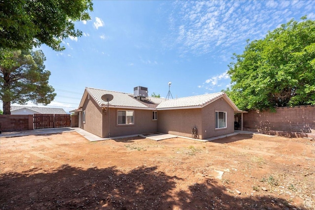 2811 E Paradise Way, St George, UT 84790 - back of house featuring a fenced backyard, stucco siding, a tile roof, and a patio