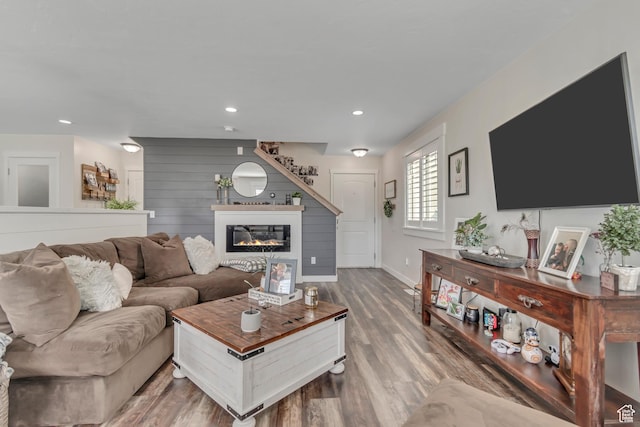 14496 S Edgemere Dr W, Herriman, UT 84096 - living area with wood finished floors, a glass covered fireplace, baseboards, and recessed lighting