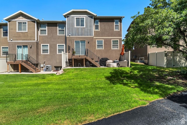 14496 S Edgemere Dr W, Herriman, UT 84096 - rear view of house featuring stairway, central AC unit, stucco siding, and board and batten siding