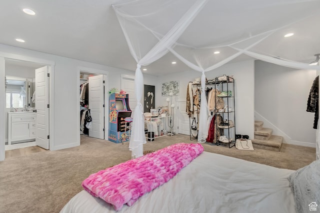 14496 S Edgemere Dr W, Herriman, UT 84096 - carpeted bedroom featuring recessed lighting, baseboards, ensuite bathroom, a walk in closet, and vaulted ceiling