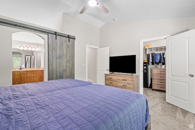 1809 E Kay Ln, South Weber, UT 84405 - bedroom with light colored carpet, vaulted ceiling, a walk in closet, a barn door, and a closet
