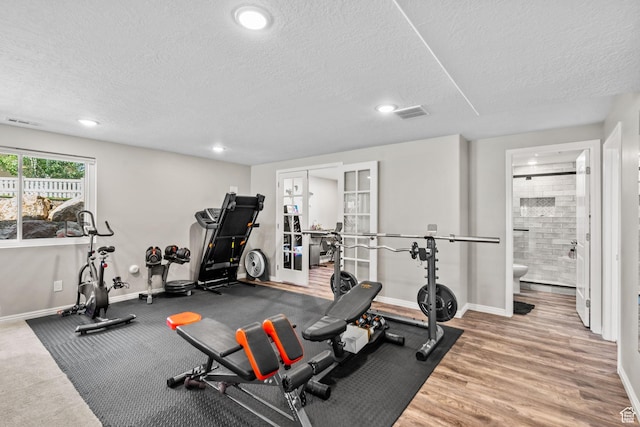 1809 E Kay Ln, South Weber, UT 84405 - exercise room featuring a textured ceiling, recessed lighting, french doors, and wood finished floors