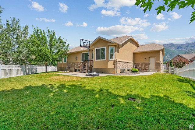 1809 E Kay Ln, South Weber, UT 84405 - back of house featuring stucco siding, a fenced backyard, and stone siding