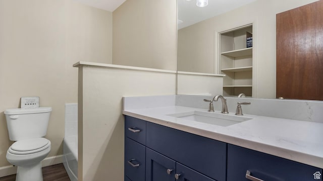 22 Creekside Ln, Centerville, UT 84014 - full bath with toilet, vanity, a tub, wood finished floors, and baseboards