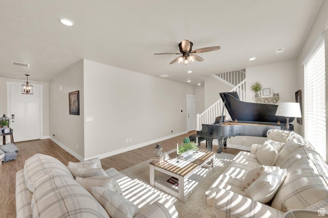 3154 S Edgewater Ln W, Syracuse, UT 84075 - living room featuring stairs, a ceiling fan, wood finished floors, recessed lighting, and baseboards