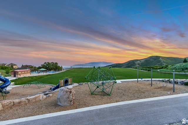 2208 E Snow Blossom Way S, Draper, UT 84020 - playground at dusk with a mountain view and a lawn