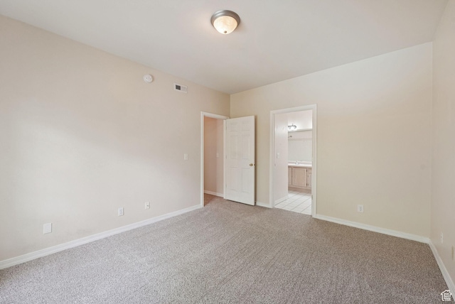 150 S 800 E Unit A9, Salt Lake City, UT 84102 - spare room featuring light colored carpet and baseboards
