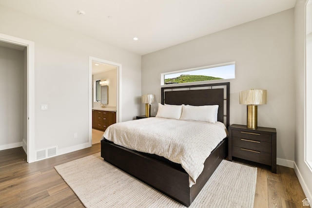 7175 Lupine Dr, Park City, UT 84098 - bedroom with baseboards, wood finished floors, ensuite bath, and recessed lighting