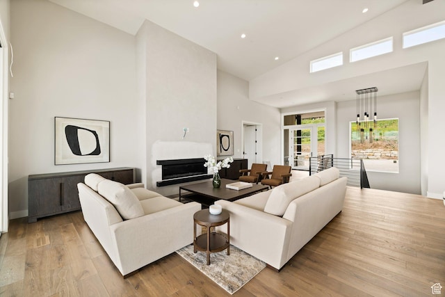 7175 Lupine Dr, Park City, UT 84098 - living room featuring high vaulted ceiling, wood finished floors, recessed lighting, french doors, and baseboards