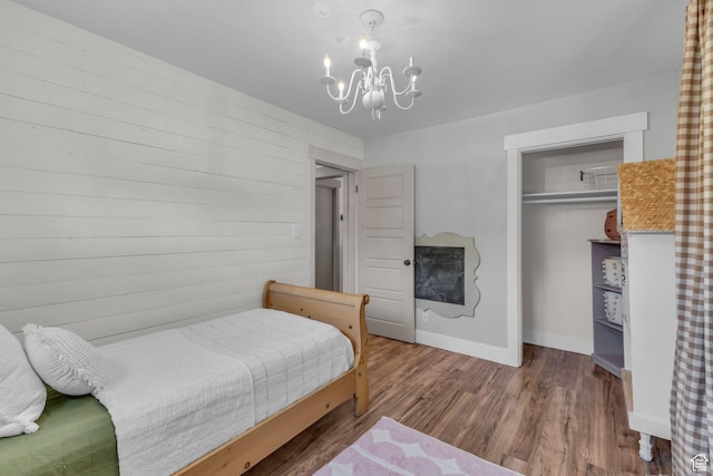 2224 N 600 W, Pleasant Grove, UT 84062 - bedroom featuring a chandelier, wood finished floors, a closet, and baseboards