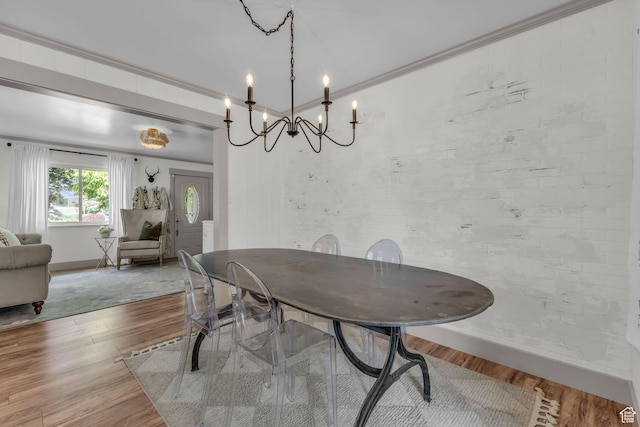 2224 N 600 W, Pleasant Grove, UT 84062 - dining space featuring baseboards, wood finished floors, a chandelier, and crown molding