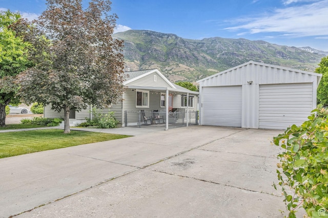 2224 N 600 W, Pleasant Grove, UT 84062 - view of front of property with a mountain view, a detached garage, a front yard, and an outdoor structure