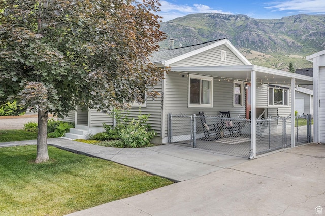 2224 N 600 W, Pleasant Grove, UT 84062 - view of front facade with a gate, a mountain view, an attached carport, and entry steps