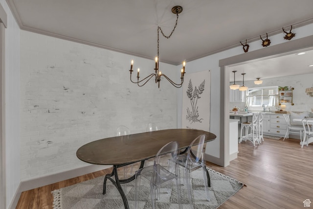 2224 N 600 W, Pleasant Grove, UT 84062 - dining space featuring light wood finished floors, a chandelier, ornamental molding, and baseboards