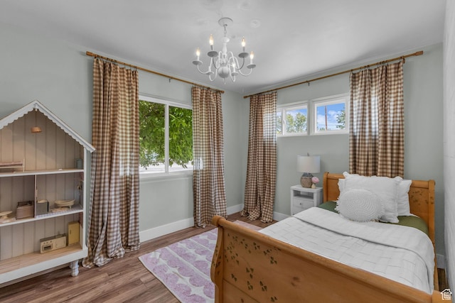2224 N 600 W, Pleasant Grove, UT 84062 - bedroom featuring a chandelier, baseboards, and wood finished floors