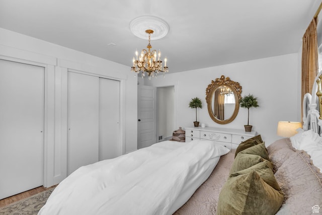 2224 N 600 W, Pleasant Grove, UT 84062 - bedroom featuring a chandelier and light wood-style flooring
