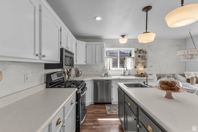 2224 N 600 W, Pleasant Grove, UT 84062 - kitchen featuring appliances with stainless steel finishes, a sink, white cabinets, dark wood-style flooring, and recessed lighting