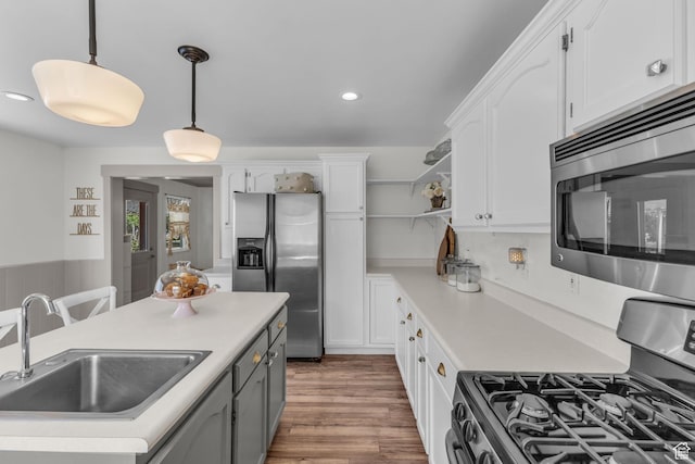 2224 N 600 W, Pleasant Grove, UT 84062 - kitchen featuring stainless steel appliances, a sink, open shelves, white cabinetry, and pendant lighting