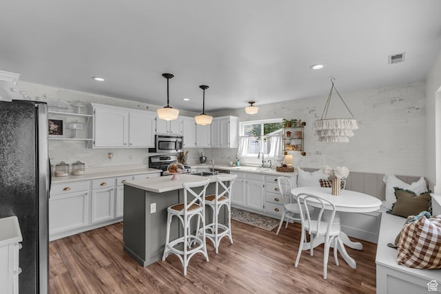 2224 N 600 W, Pleasant Grove, UT 84062 - kitchen featuring stainless steel appliances, open shelves, white cabinets, a kitchen island, and recessed lighting