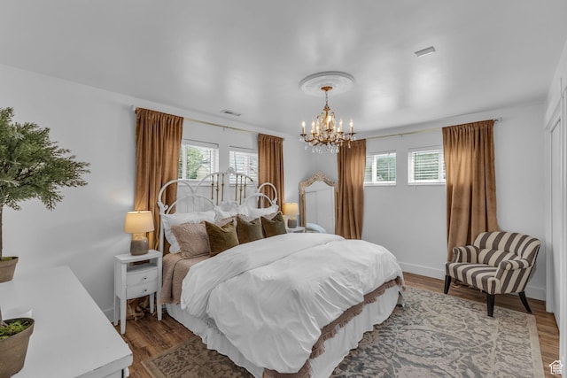 2224 N 600 W, Pleasant Grove, UT 84062 - bedroom with a chandelier, dark wood-style floors, and baseboards