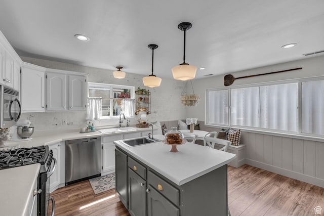2224 N 600 W, Pleasant Grove, UT 84062 - kitchen with stainless steel appliances, a sink, a center island with sink, white cabinetry, and recessed lighting