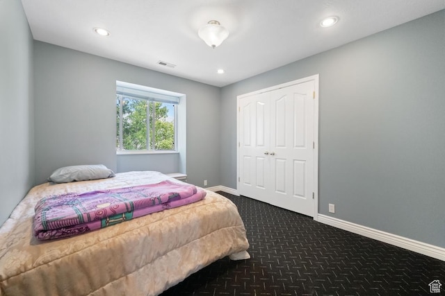 8298 S Arlington Ct, West Jordan, UT 84088 - bedroom with dark colored carpet, recessed lighting, and a closet