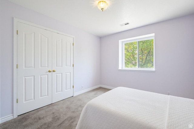 8298 S Arlington Ct, West Jordan, UT 84088 - carpeted bedroom featuring a closet and baseboards