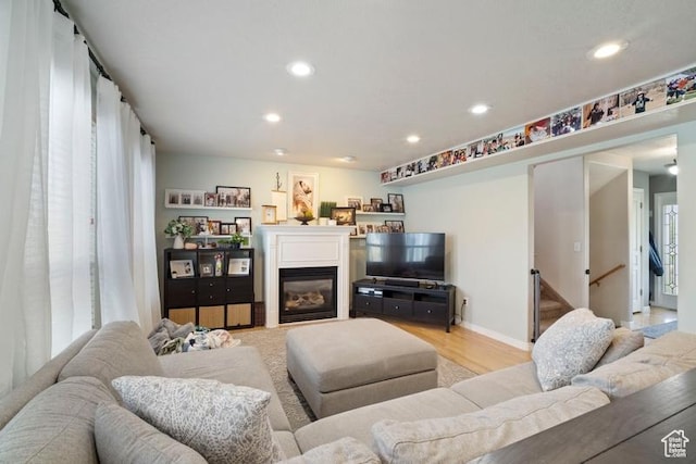 787 N 500 W, Brigham City, UT 84302 - living room with a glass covered fireplace, recessed lighting, and light wood-style floors