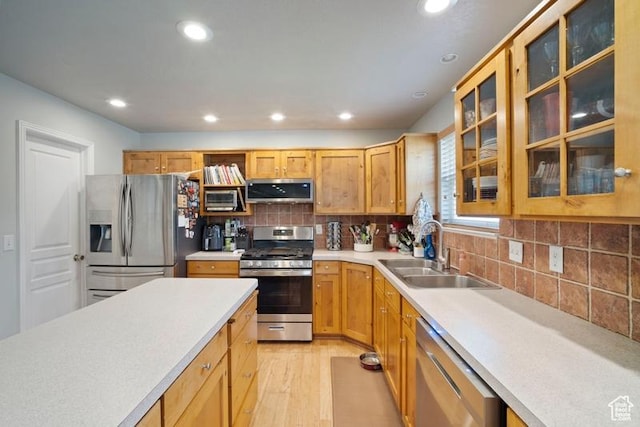 787 N 500 W, Brigham City, UT 84302 - kitchen featuring appliances with stainless steel finishes, a sink, light wood-style flooring, recessed lighting, and light countertops