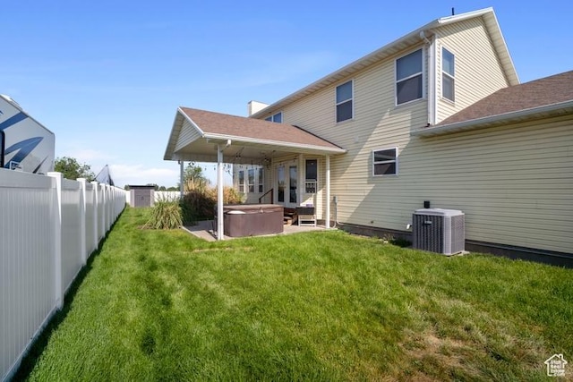 787 N 500 W, Brigham City, UT 84302 - rear view of house with a hot tub, central AC unit, and a patio area