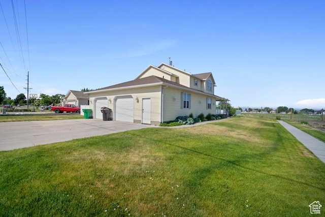787 N 500 W, Brigham City, UT 84302 - view of property exterior featuring driveway, a yard, and a garage