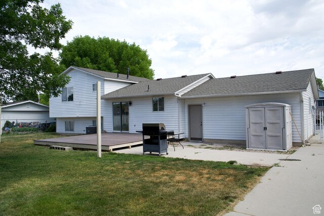 1102 E 120 S, Spanish Fork, UT 84660 - back of property with a deck, a yard, roof with shingles, and central AC