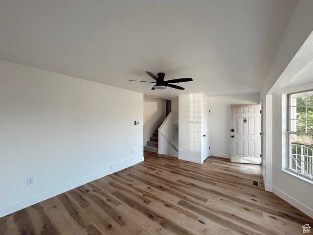 1102 E 120 S, Spanish Fork, UT 84660 - unfurnished living room with wood finished floors, stairs, and ceiling fan