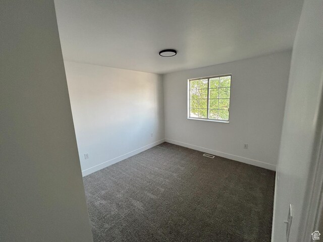 1102 E 120 S, Spanish Fork, UT 84660 - empty room featuring dark colored carpet and baseboards