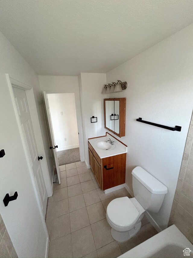 1102 E 120 S, Spanish Fork, UT 84660 - bathroom with toilet, vanity, and tile patterned flooring