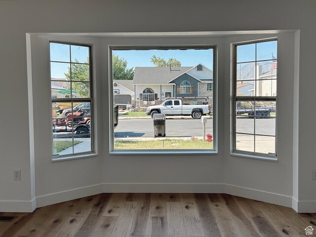 1102 E 120 S, Spanish Fork, UT 84660 - unfurnished dining area featuring baseboards and wood finished floors